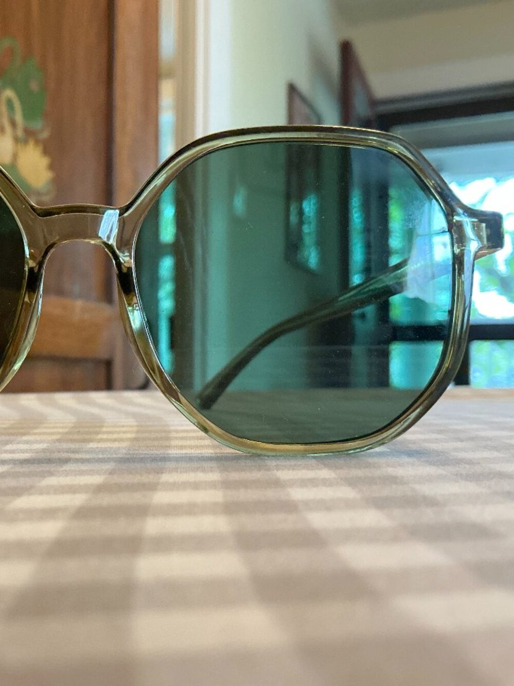 Green framed sunglasses with green lens